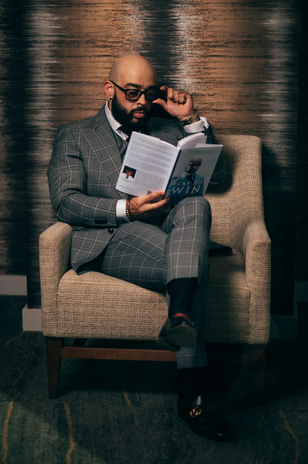 woman-in-gray-blazer-sitting-on-brown-sofa-chair-sy3mwaz1mdc